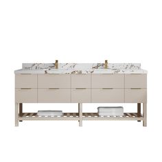 a double sink vanity with two gold faucets and marble counter tops on each side