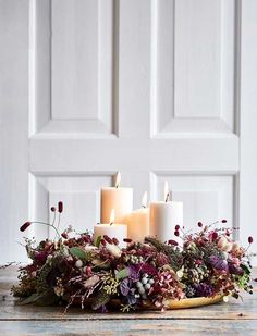 a bunch of candles sitting on top of a table