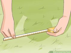 a person measuring grass with a tape measure