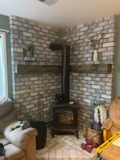 a living room filled with furniture and a wood burning stove