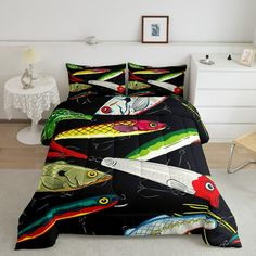 a bed room with a neatly made bed covered in black sheets and colorful fish on it