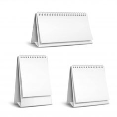 three white desk calendars with blank pages