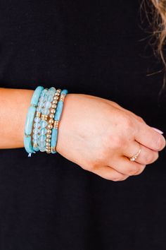 Elevate your style with this fabulous bracelet! This beautiful, beaded design in a lovely blue color can be worn as a set or individually, making it versatile and perfect for any outfit! Show your love and elevate your fashion sense at the same time! Blue Crystal Bracelet With Stackable Round Beads, Trendy Turquoise Stackable Beaded Bracelets, Blue Stackable Stretch Bracelet, Stackable Blue Stretch Bracelet, Blue Stackable Beaded Bracelets As Gift, Blue Stackable Wrap Bracelet As Gift, Adjustable Blue Stackable Wrap Bracelet, Blue Wrap Bracelet With Colorful Beads, Adjustable Blue Stackable Stretch Bracelet