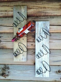 a wooden sign with writing on it that says bed springs on pallet wood excellent idea for wine holder