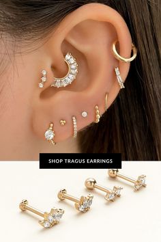 three pairs of ear piercings with crystal stones