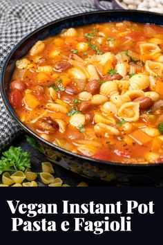 vegan instant pot pasta e fagioli in a black bowl with parsley on the side