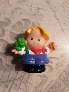 a small toy figurine sitting on top of a table