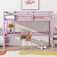 a pink bunk bed sitting next to a chair