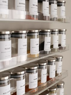 the shelves are filled with different types of spices