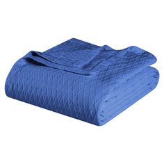 a blue quilted blanket folded on top of each other