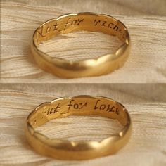 two gold rings with words written on them