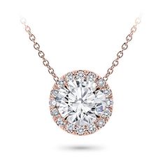 This halo pendant setting is stunning and can accommodate a round center diamond of your choice from 0.20-5.0ct. Pendant features approx. 18 G-H VS diamonds at approx. 0.20cttw. Metal options are 14k and 18k white and yellow gold, 18k rose, or platinum and includes a 16 chain. Classic Round Pendant Jewelry, Unique Diamond Pendant, Cushion Cut Solitaire, Round Diamond Pendant, Diamond Pendants Designs, Halo Necklace, Diamond Necklace Set, Diamond Solitaire Necklace, Sparkly Things