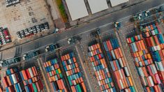 an aerial view of shipping containers at the port