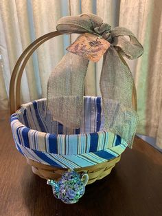 a basket with a bow on it sitting on a table