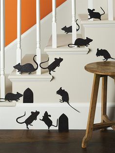 a set of stairs with black mice on them