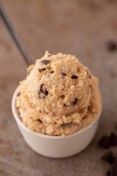 a white bowl filled with ice cream and chocolate chips