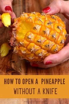 two hands holding a pineapple on top of a wooden table with the words how to open a pineapple without a knife