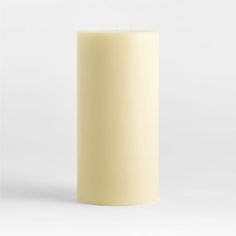 a tall white candle is shown against a white background