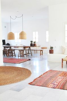 a living room filled with furniture and rugs