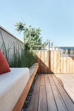 a wooden bench sitting on top of a wooden deck