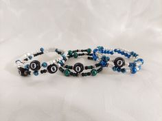 Beautiful 8 ball bracelet for the pool player in your life or for a league team mate. Ball Jewelry, 8 Ball Pool, Ball Pool, Bead Charms Diy, Ball Bracelet, 8 Ball, Memory Wire, Birthday Gift For Her, Jewelry Unique