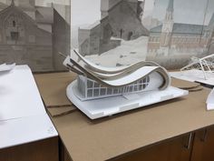 a model of a building sitting on top of a table