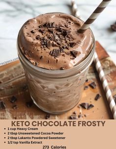 chocolate frosted drink in a mason jar with two straws on the side and text that reads keto chocolate frosty