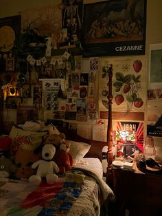 a bed room with a neatly made bed and lots of pictures on the wall