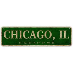 a green street sign that says chicago, illinois