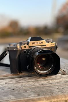 a camera sitting on top of a wooden table