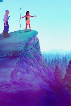 two people standing on top of a mountain looking at something in the sky above them