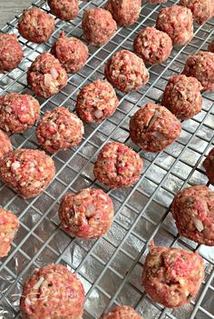 raw meatballs on a cooling rack ready to be cooked