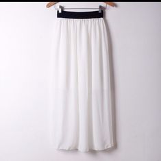 This Super Cute Chiffon Skirt Is Perfect For Spring And Summer! It Is So Lightweight And Airy. It Also Comes In Gorgeous, Vibrant Colors! This Has A Lining As Well. These Have Elastic At The Top And It Goes From 24"-40". It Is 34.5" Long. Made Of 100% Polyester. Chic White Chiffon Skirt, Casual White Chiffon Skirt, Casual White Chiffon Bottoms, Chic Chiffon Skirted Bottoms, Flowy White Chiffon Skirt, White Chiffon Maxi Skirt, Elegant Chiffon Skirt For Vacation, Elegant Chiffon Bottoms For Vacation, Chiffon Skirted Bottoms With Elastic Waistband