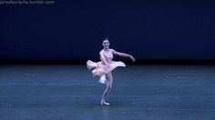 a ballerina is performing on the stage