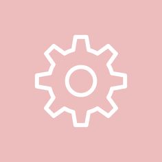 a white gear wheel on a pink background