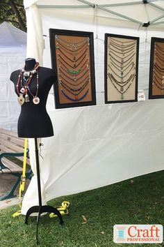 a table with jewelry on display under a tent