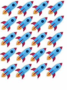 a bunch of blue and red rockets flying in the air with their tails pointing upward