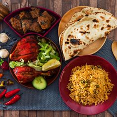 the meal is prepared and ready to be eaten on the wooden table with utensils