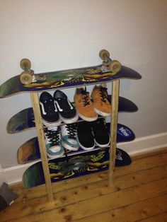 there is a skateboard rack with shoes on it