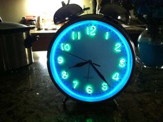 an alarm clock sitting on top of a counter