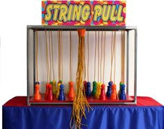 a colorful display with beads and toys on it's sides, including a sign that says string pull