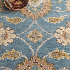 a blue rug with an ornate design on it