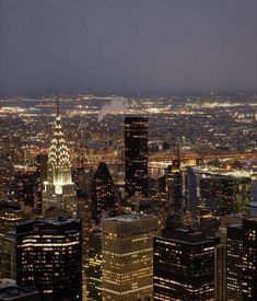 the city lights shine brightly at night in this view from top of the empire building