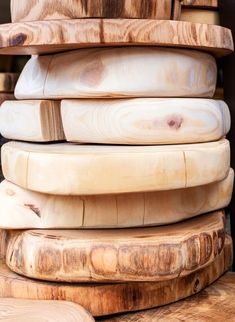 a stack of wooden cutting boards stacked on top of each other