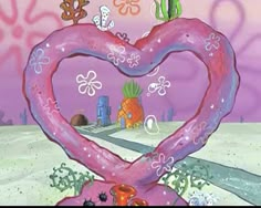 a pink heart - shaped object in the middle of a cartoon scene with other objects surrounding it