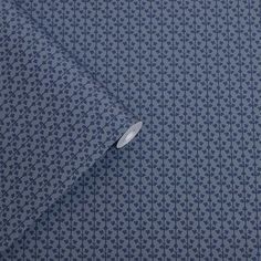 a close up view of a blue and white shirt with an interesting pattern on it