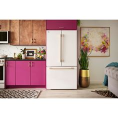 a white refrigerator freezer sitting inside of a kitchen