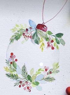 an ornament with holly and berries on it