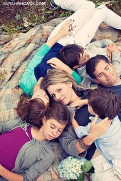 a group of people laying on top of each other