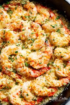 a skillet filled with shrimp and cheese